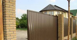 Купить откатные ворота из профнастила Магадан, цена от 1745 руб.
